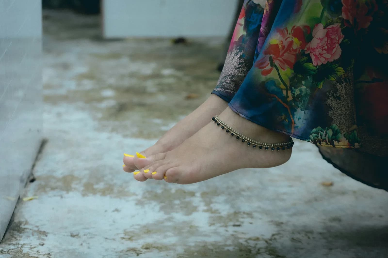 Temple 22K Gold Anklet - Woman's feet with an anklet