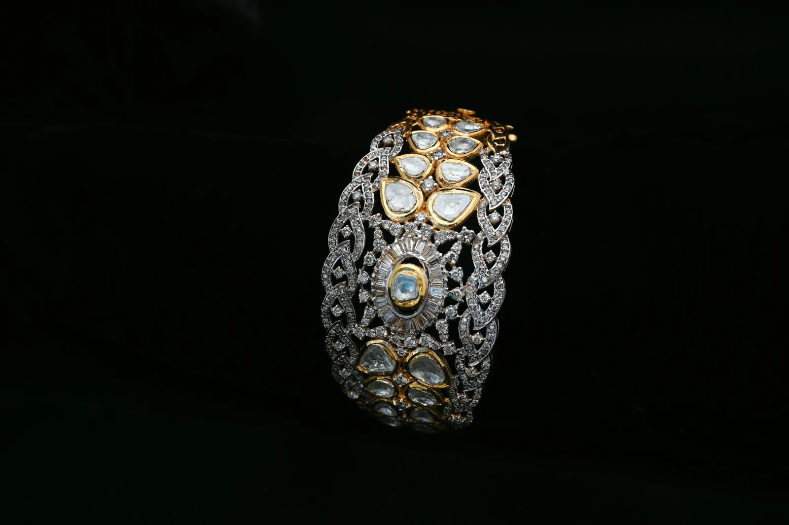 Layered Antique Gold Bangle - A gold and diamond bracelet on a black background