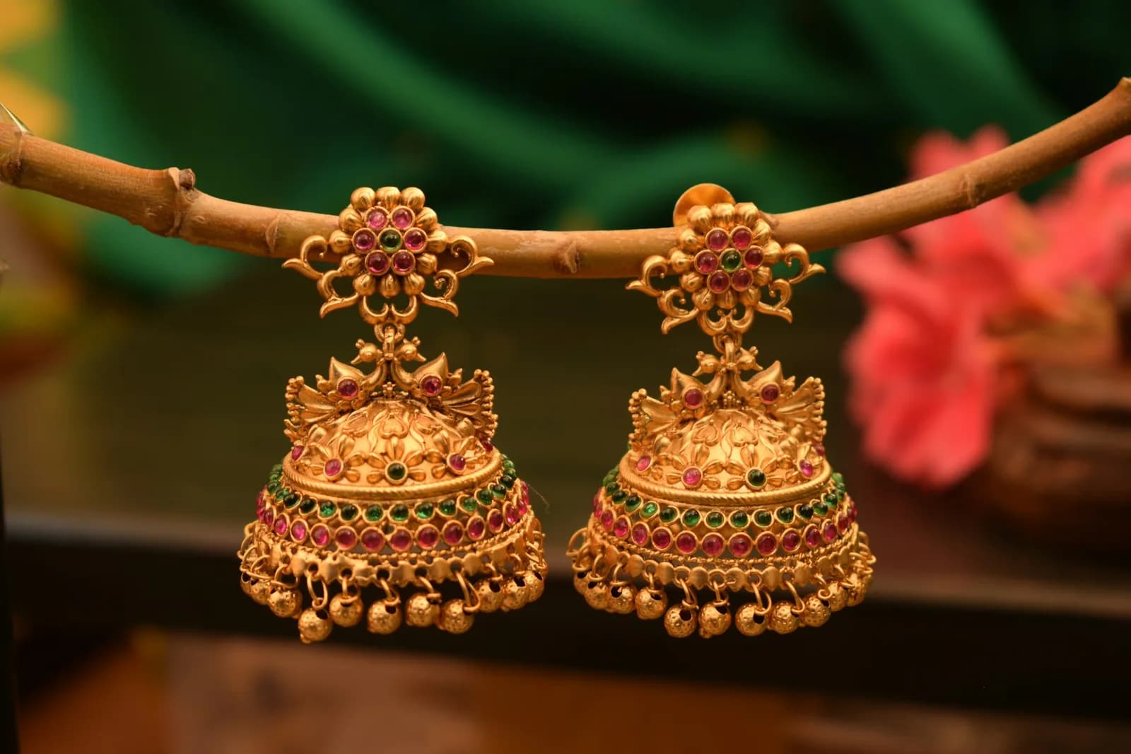 Drop Polki Diamond Earrings - A close up of a pair of earrings on a branch