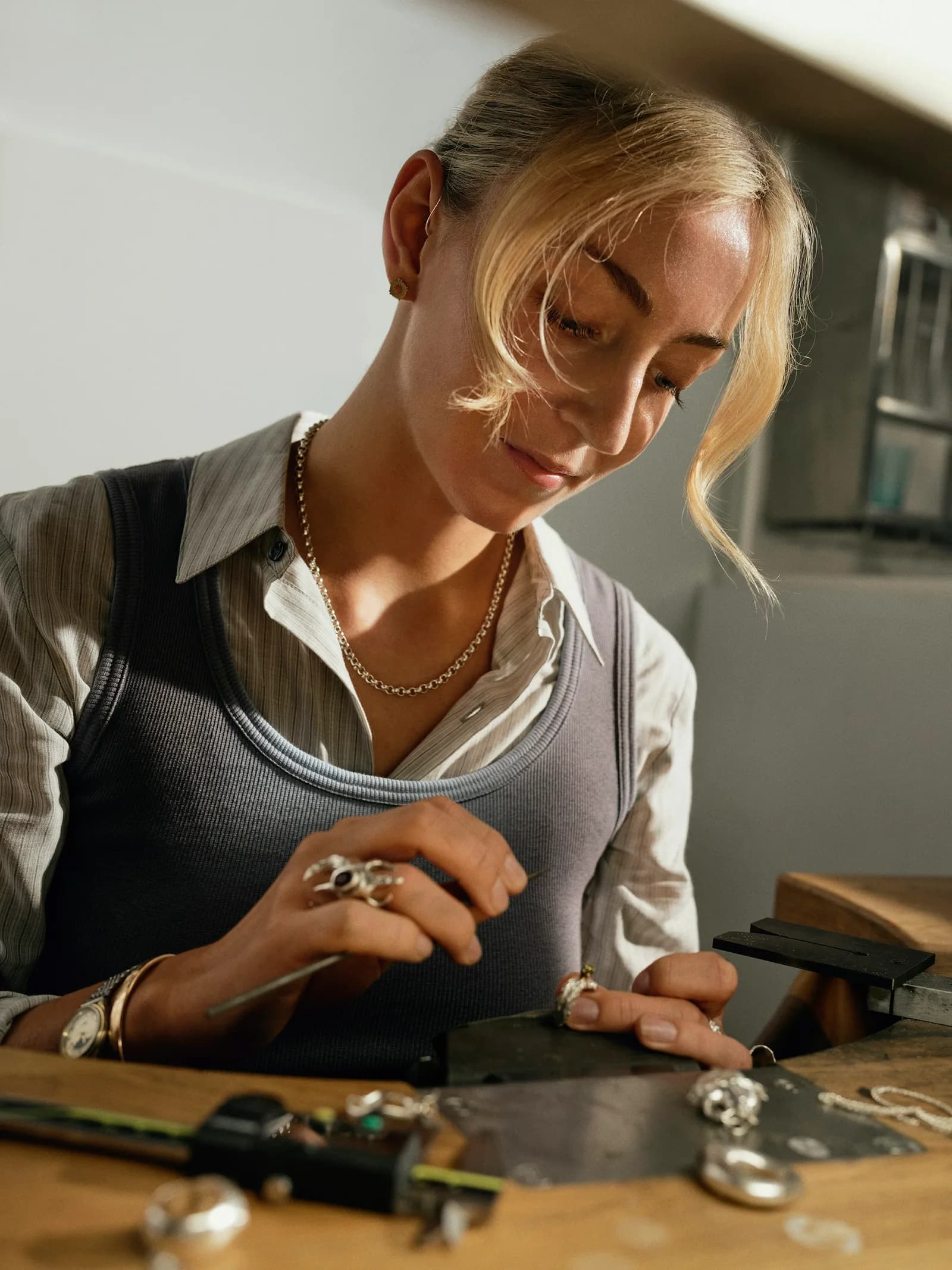 Artisan working on jewellery at a workbench