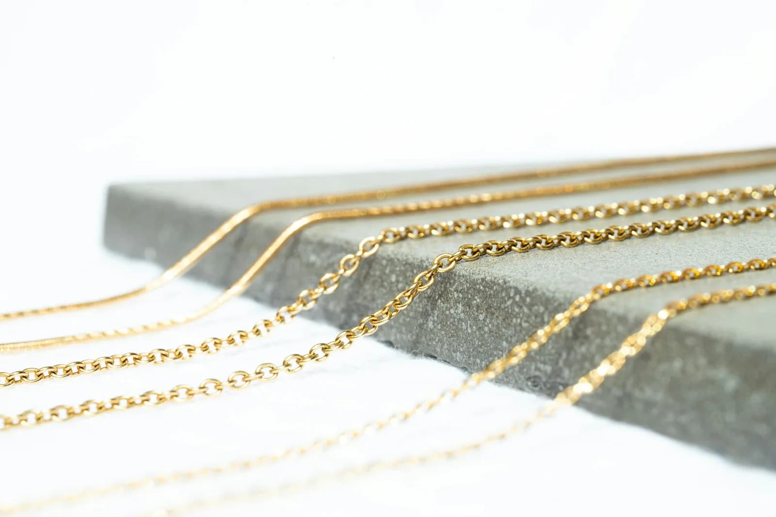 Vati 18K Gold Mangalsutra - A gold chain with a black band