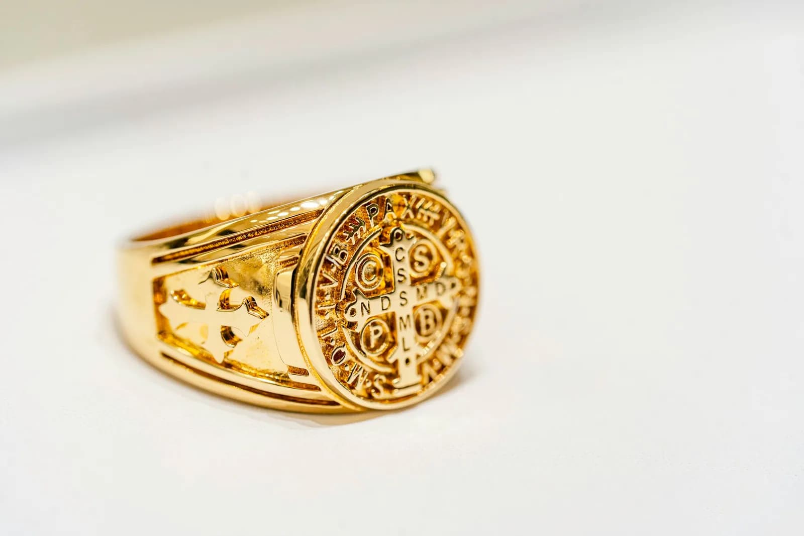 Nakshi 18K Gold Ring - A close up of a gold ring on a white surface